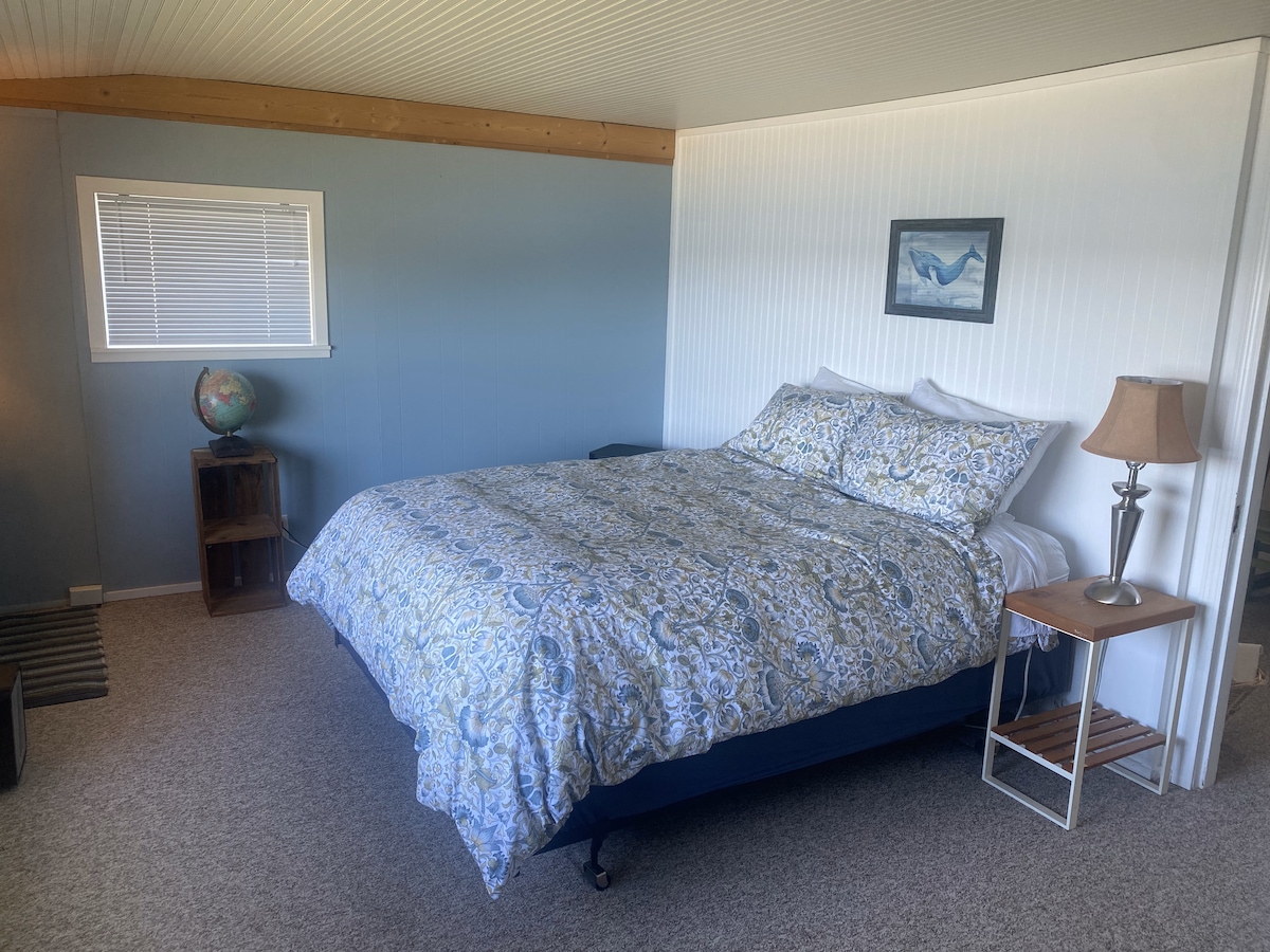 Bedroom with a water-facing window