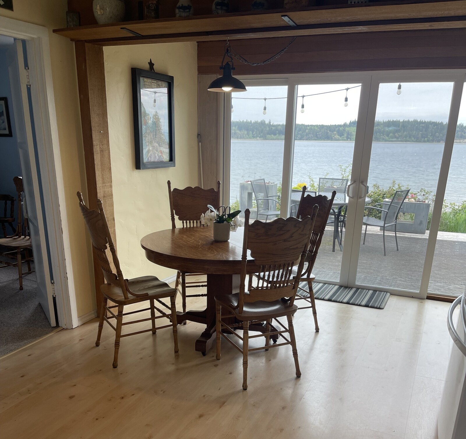Dining area with glass doors to the bay