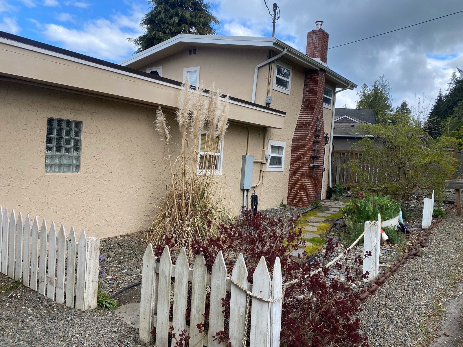 Front exterior of the beige beach cottage