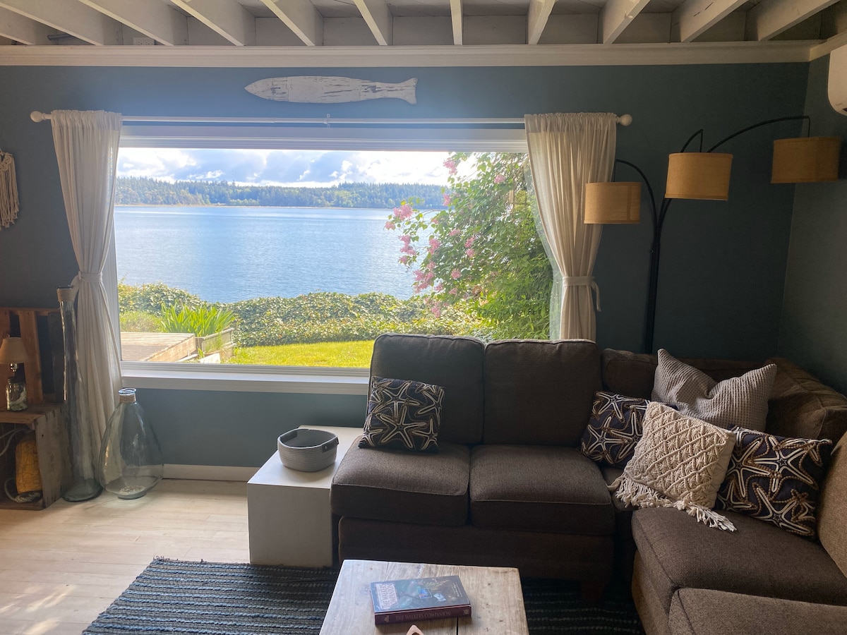 Living room with large picture window overlooking the bay